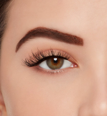 A model wearing Ardell Naked Lashes 425 featuring a whisper-light Wispies® layering and a short length for the natural look.