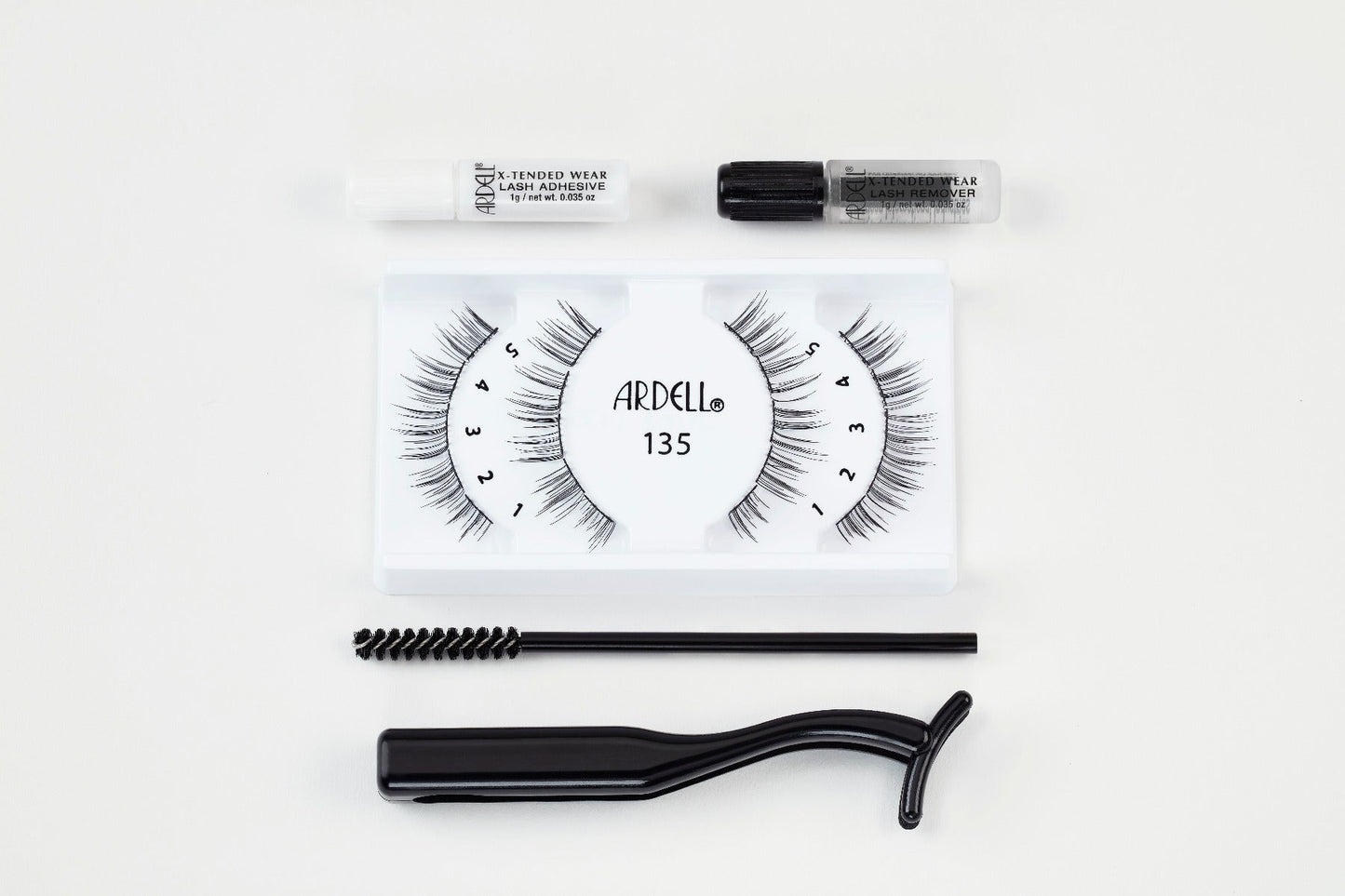 Ardell X-Tended Wear Lash Kit with 135 segments, adhesive, remover, spoolie, and applicator for seamless long wear.