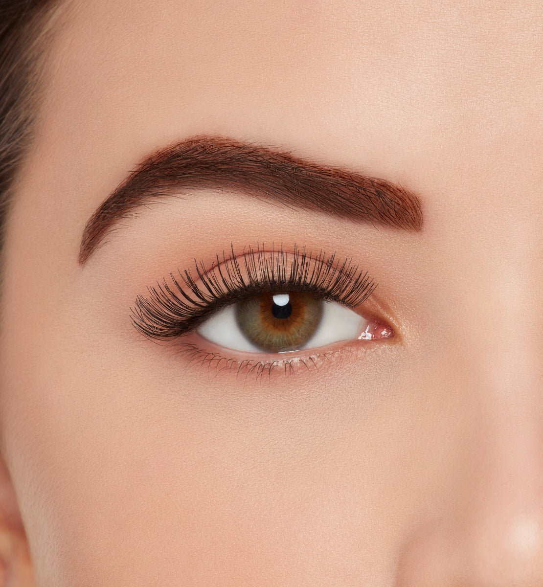 Front view of a model with wearing Ardell, X-tended Wear #105 lashes to show how they look on the eye